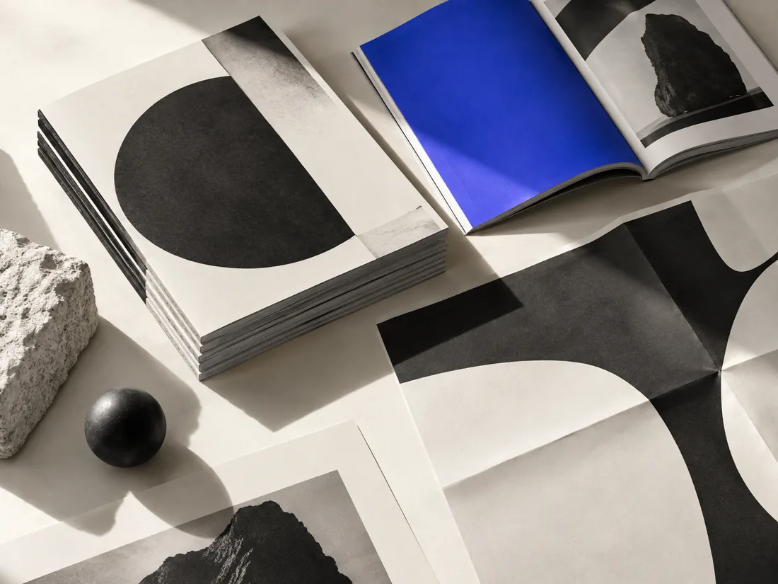 Conceptual studio image of an editorial publication and print display.